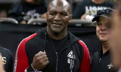 Evander Holyfield Reflects on Brutal Fight: ‘Asked If My Teeth Were Still In’ - Evander Holyfield vs George Foreman
