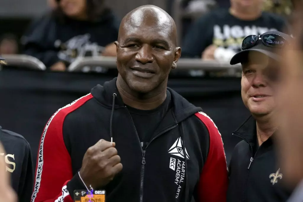 Evander Holyfield Reflects on Brutal Fight: ‘Asked If My Teeth Were Still In’ - Evander Holyfield vs George Foreman
