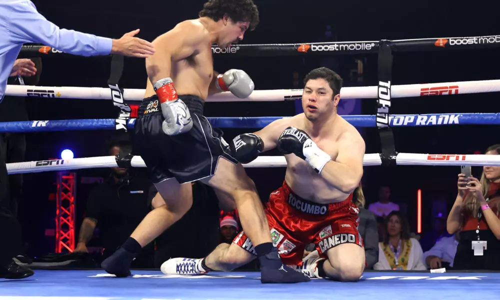 Richard Torrez Jr (L) knocks-down Marco Antonio Canedo (R) during their heavyweight fight at Hard Rock Hotel & Casino Tulsa on August 27, 2022 in Catoosa, Oklahoma.