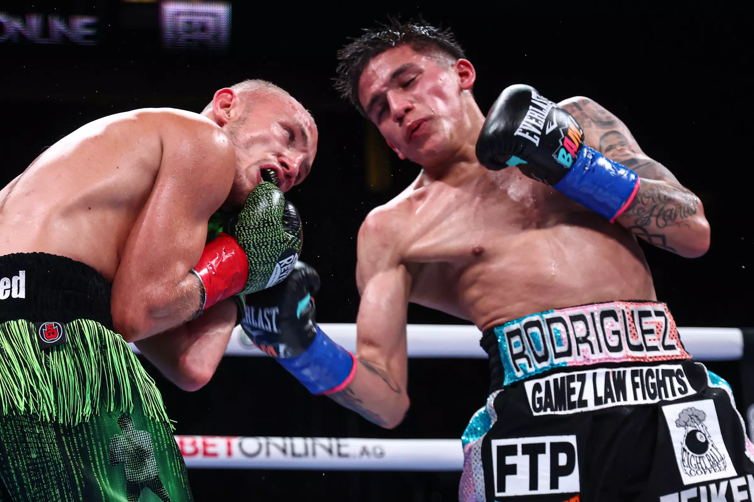 Jesse Rodriguez landing a right uppercut against Sunny Edwards