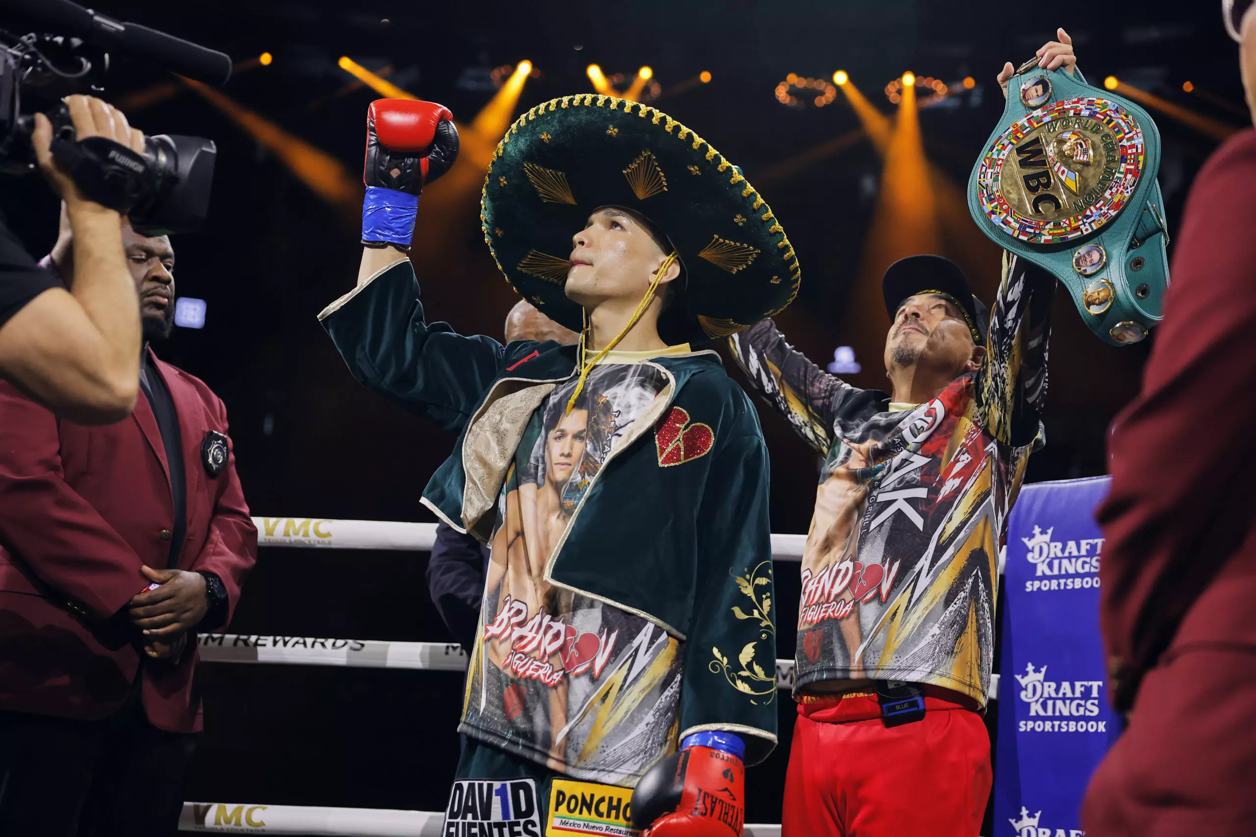 Brandon Figueroa raises his glove in the ring