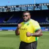 Jarrell Miller in a Norwich City football shirt in a promo photo before his fight with Fabio Wardley was cancelled