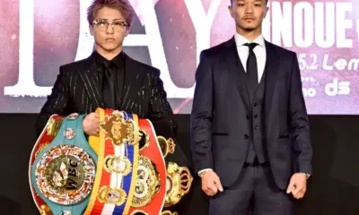 Naoya Inoue vs Junto Nakatani promotional face off with Inoue's belts.