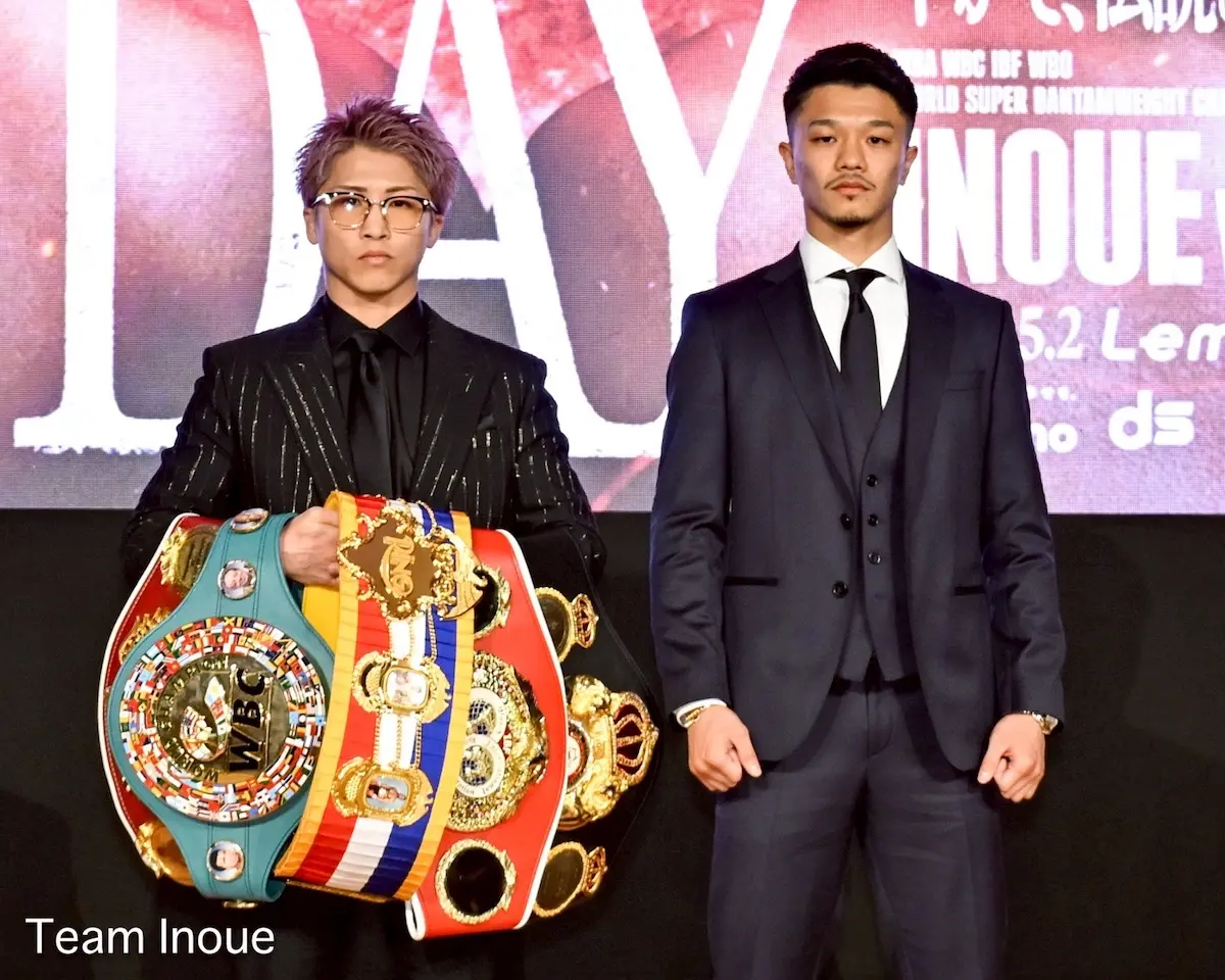 Naoya Inoue vs Junto Nakatani promotional face off with Inoue's belts.