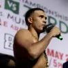 David Benavidez holding microphone at press conference for Gilberto Ramirez fight