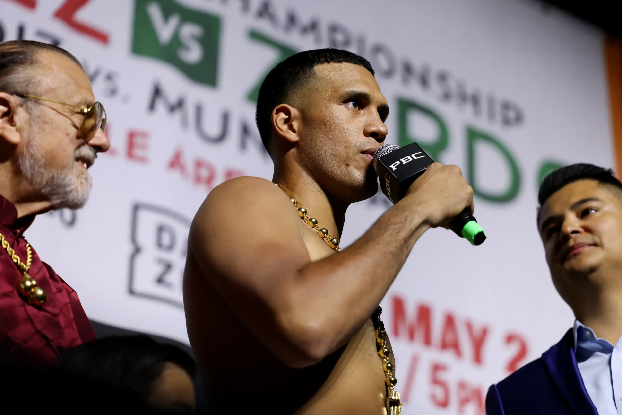 David Benavidez holding microphone at press conference for Gilberto Ramirez fight