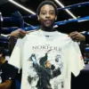 Keyshawn Davis vs Nahir Albright: Keyshawn Davis holding Norfolk Redemption t-shirt