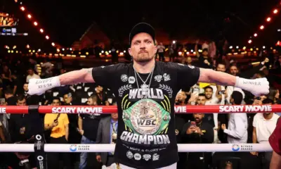 Oleksandr Usyk in the ring wearing a world champion t shirt