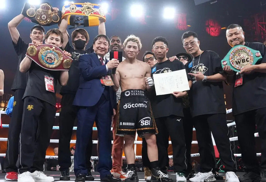 Naoya Inoue and his team in the ring after victory over Junto Nakatani.