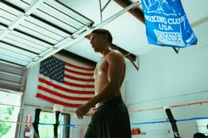 Antonio Vargas in training camp ahead of Bam Rodriguez fight with American flag above the ring.