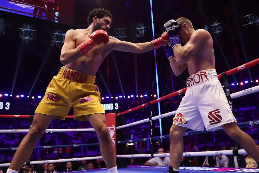 Hamzah Sheeraz throws out lead left hand against Simon Zachenhuber