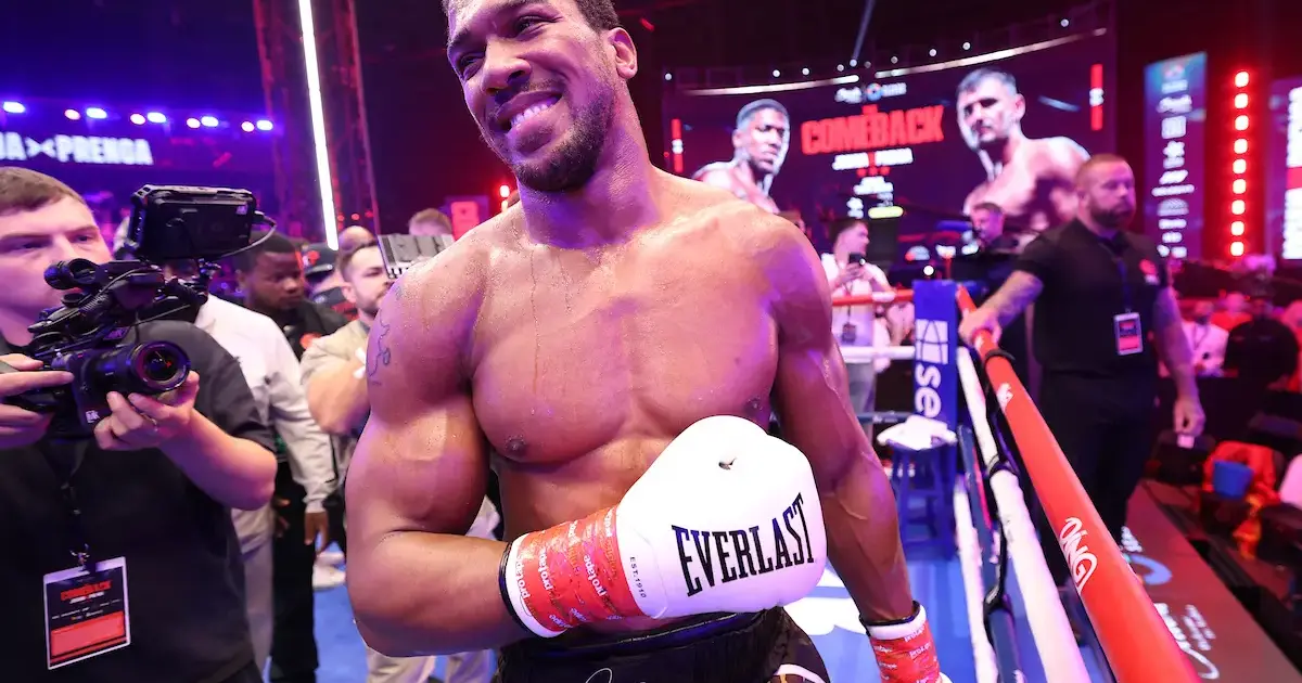 Anthony Joshua smiling after victory against Kristian Prenga