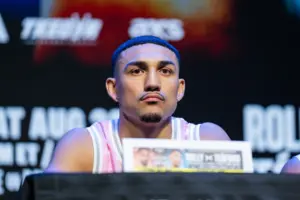 Teófimo López sitting at a press conference