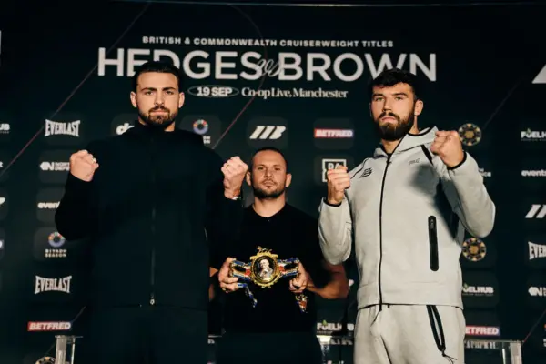 John Hedges and Pat Brown face the cameras