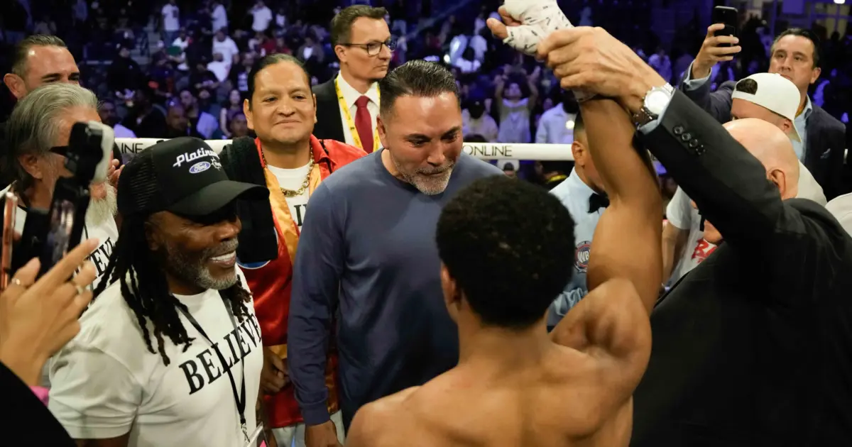 Floyd Schofield with Oscar De La Hoya after Lucas Bahdi win